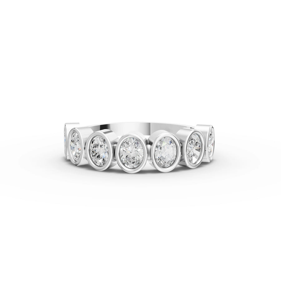 0.95 ct oval lab grown diamond half eternity ring with bezel set stones and sleek polished band
