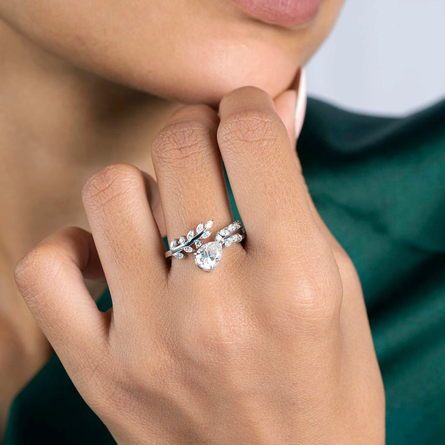 Model wearing pear halo diamond ring