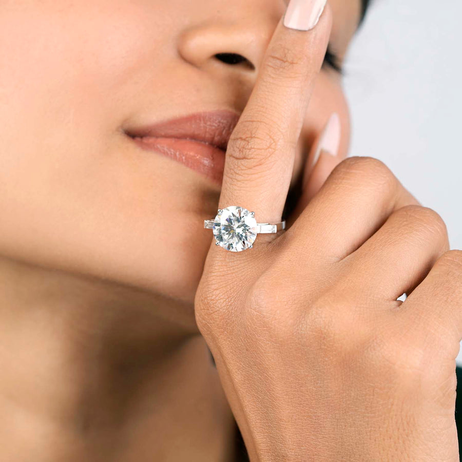 7.34 CT round lab-grown diamond engagement ring worn on hand