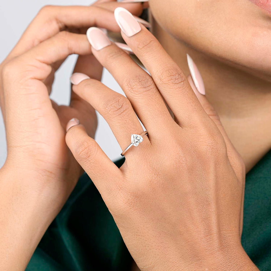 Model wearing heart solitaire ring