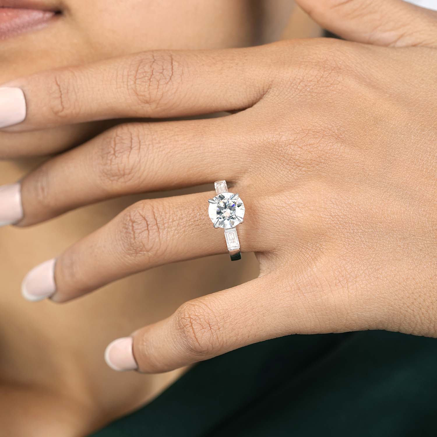 3.25 CT round lab-grown diamond three stone engagement ring worn on hand