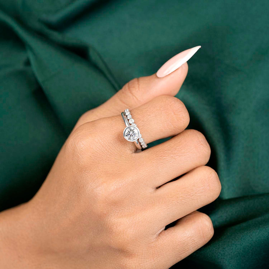 1.84 CT round lab-grown diamond bezel ring worn on hand