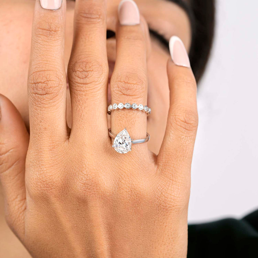 Lab-grown pear bridal set hand close-up