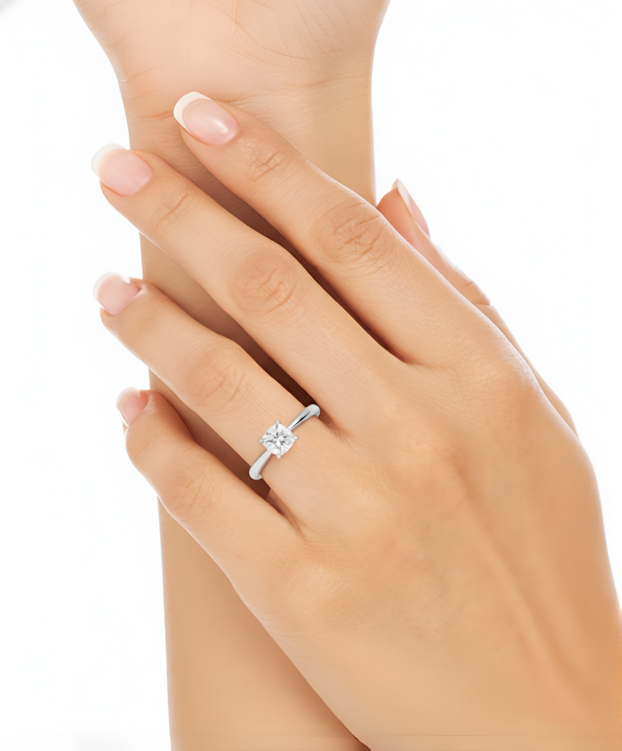 1.25 CT cushion lab-grown diamond ring worn on finger